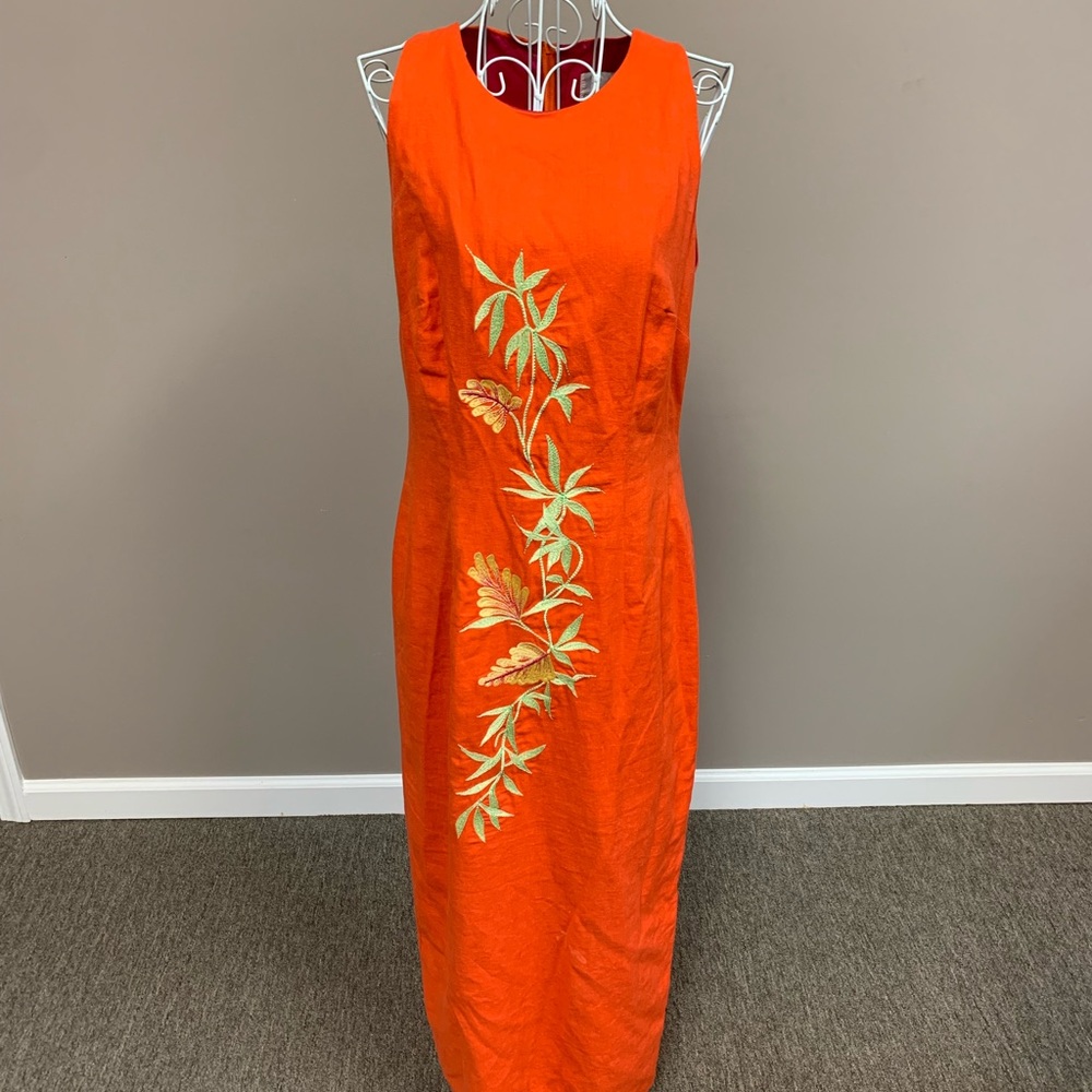 Long orange dress with floral detailing